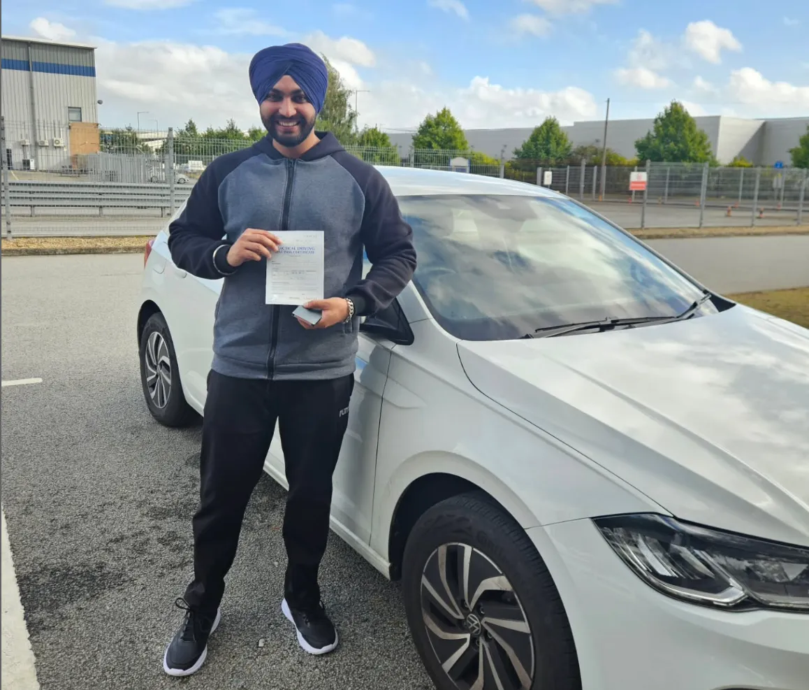 Client with his pass certificate next to the exam car